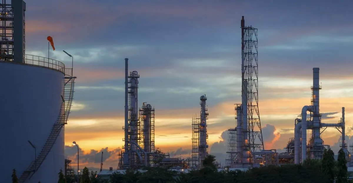 Silhouette of petrochemical plant or Oil and gas refinery in sunrise