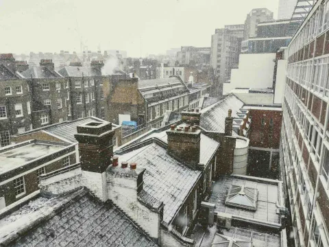 Winter cityscape of houses and buildings in England.