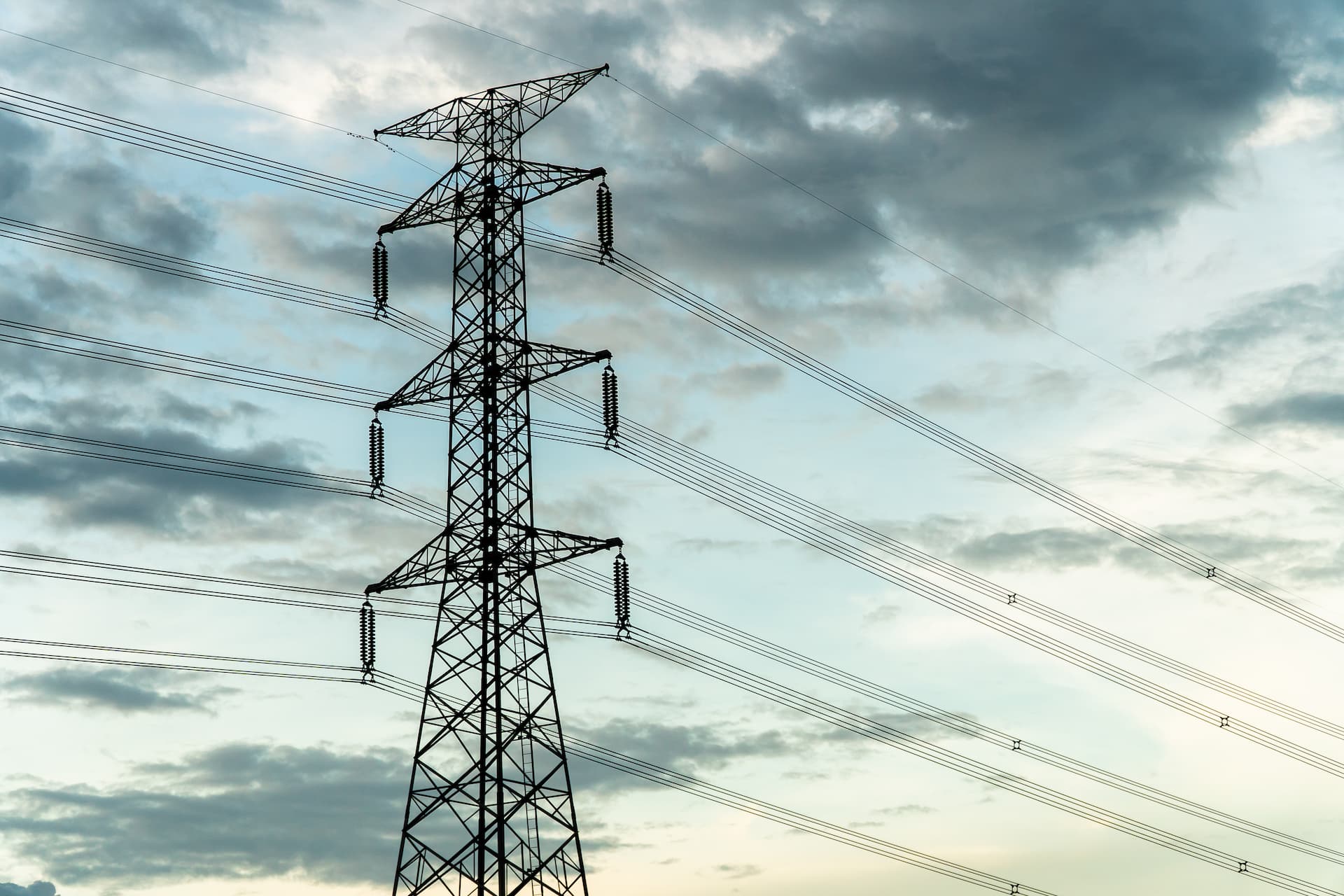 Silhouette of pylon against sky
